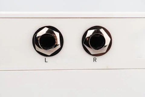 Close-up of modern mini guitar amplifier speaker, white in color, with a LI.. Stock Photos
