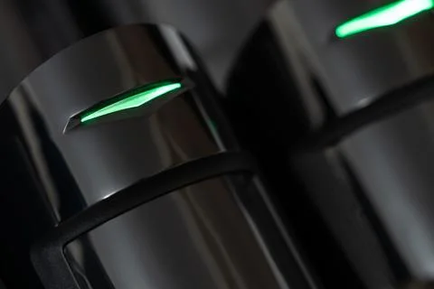 Close-up of a modern motion detector In action.shallow depth of field. Stock Photos