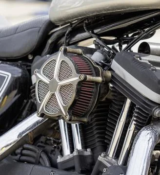 Close-up of a modern motorcycle engine model with frame and exhaust system .. 스톡 사진