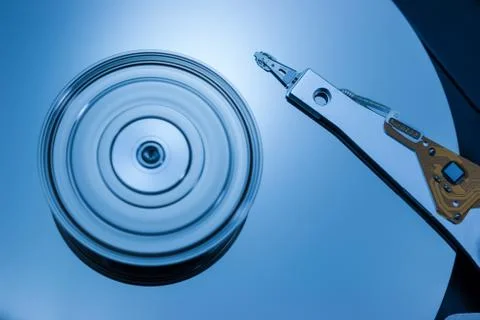 Close up of modern opened hard disk drive. Stock Photos