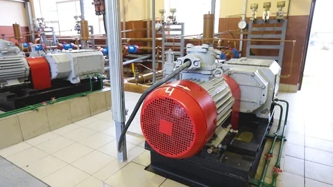 Close-up of a modern powerful compressor with pipelines in a large refinery Stock Footage 124906661