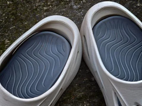 Close-Up of Modern Rubber Clogs Footbed with Wave Pattern Textured Insole Stock Photos