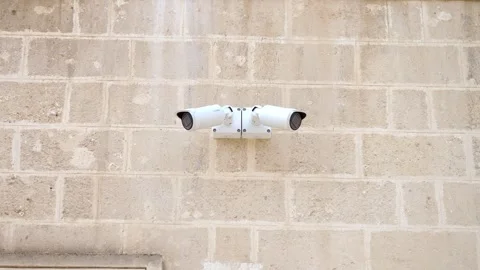 A close-up of modern security cameras installed in the historic center of Matera Stock Footage 305853535