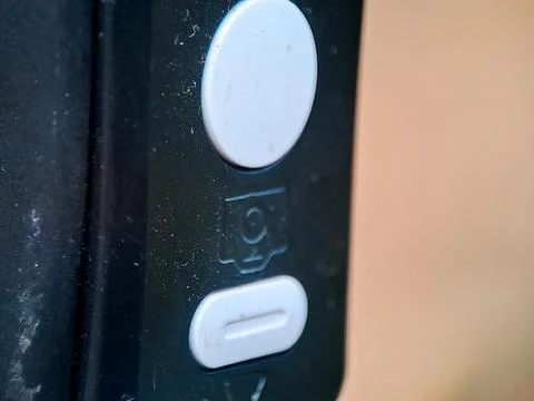 Close up of a modern smart doorbell with camera lens and button. Fotos Stock