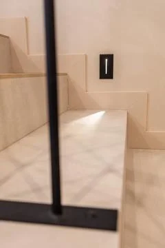 Close-up of modern stone stairs with embedded LED step light Foto stock