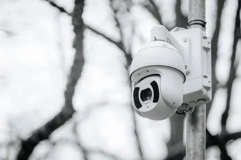 A close-up of a modern surveillance camera system mounted on a metal pole Stock Photos