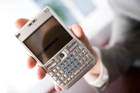 Close-up of modern technological device held by human hand Stock Photos