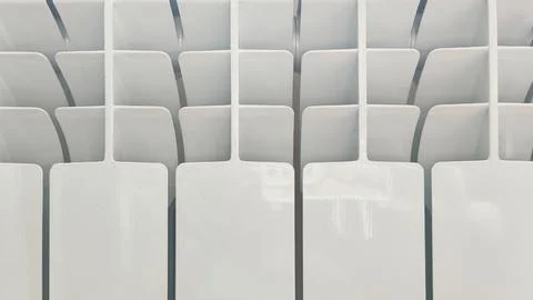Close up of a modern white radiator surface with clean geometric lines Stock Photos