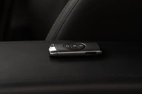 Close up of a modern wireless car key. Modern car interior. Stock Photos