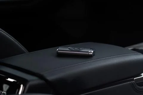 Close up of a modern wireless car key. Modern car interior. Stock Photos