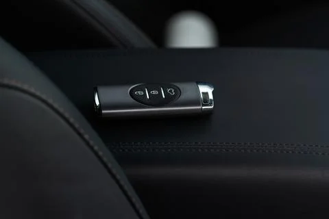 Close up of a modern wireless car key. Modern car interior. Stock Photos