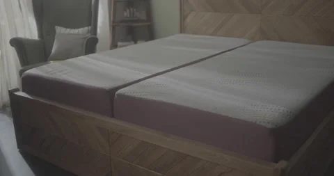 Close up of a modern wooden bed frame with two mattresses. Stock-Footage 330156423