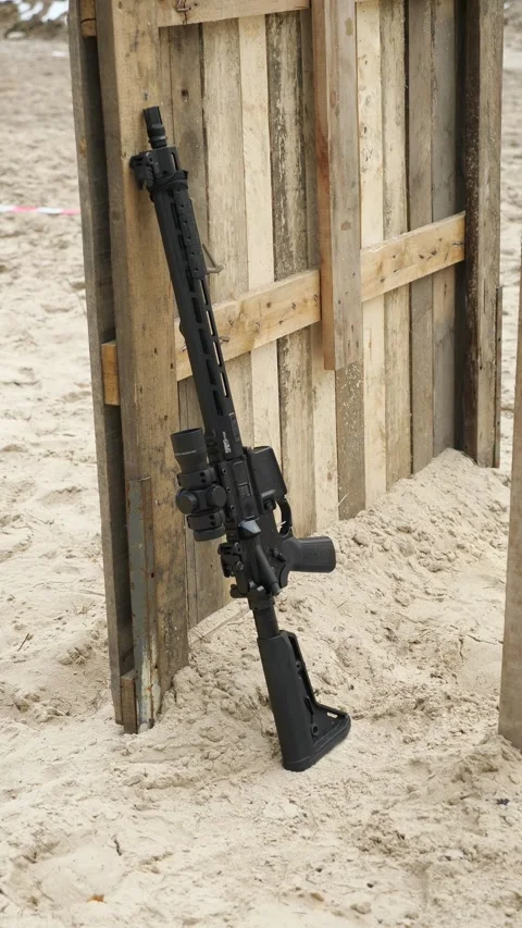 Close-up of modernized assault rifle with tactical scope outdoors Stock Footage 333612697