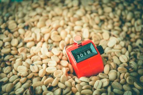 Close up module or digital count on unroasted coffee beans Stock Photos