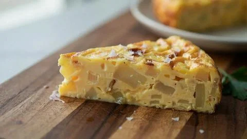 Close-up of a moist lemon cake slice with crumbly texture on a rustic wooden Stock Photos