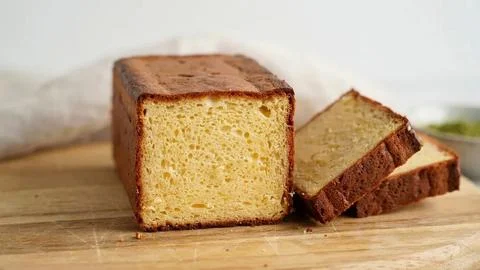 Close-up of moist yellow sponge cake with caramel glaze, cut into pieces on a Stock Photos