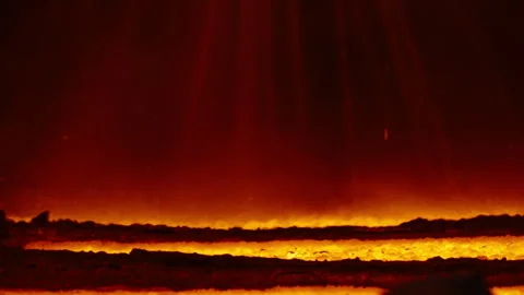 Close-Up of Molten Lava Flow with Glowing Embers and Heat Haze Stock Footage 346226066