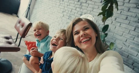 Close-up of mom with children doing selfie smiling happy having fun playing on Stock Footage