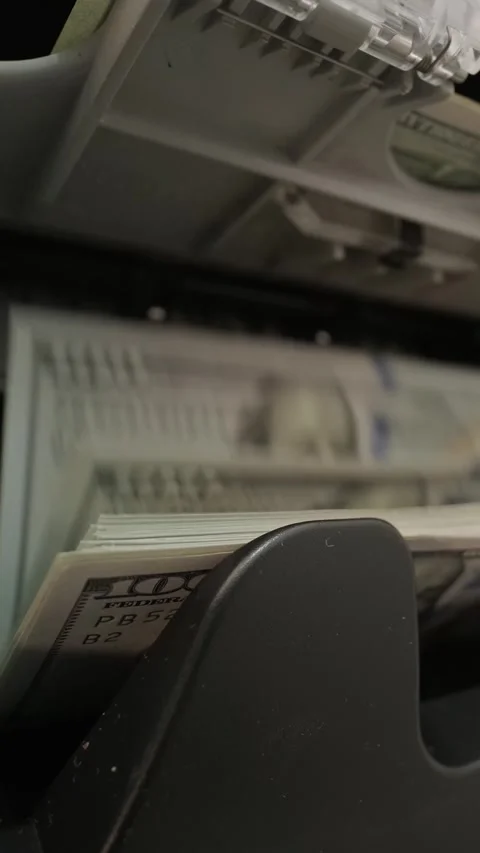 Close-up of money counter machine processing 100 US dollar bills. Banking concep Stock Footage 331504299