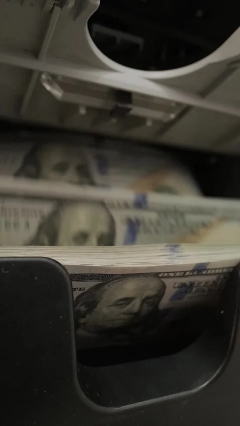 Close-up of money counter machine processing 100 US dollar bills. Banking concep Stock Footage 331504300