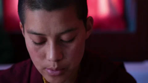 Close up of a monk (nun) reading the ancient buddhist script during a ritual. Stock Footage 31841162