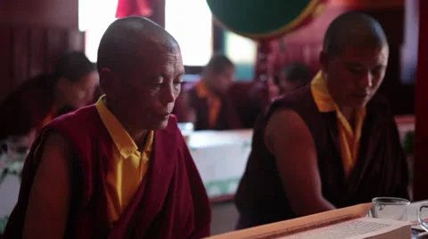 Close up of a monk (nun) reading the ancient buddhist script during a ritual. Stock Footage 32529276