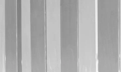Close-up of monochrome vertical window blinds showing repeating panels Stock Photos
