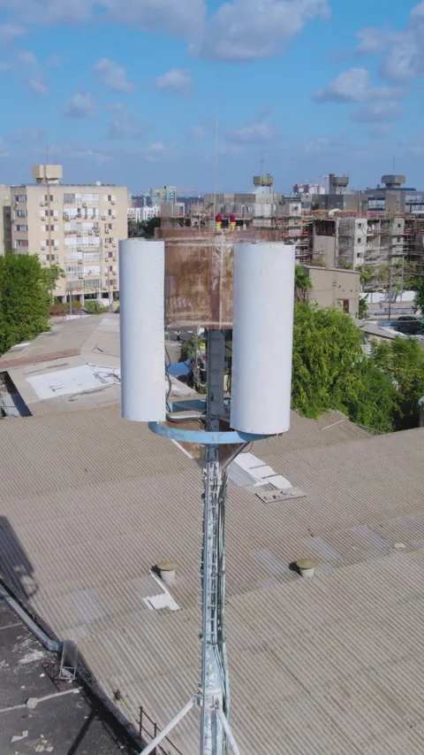 Close-up on monopole Cell phone tower Hidden antenna on a building in a small Stock Footage 315219457
