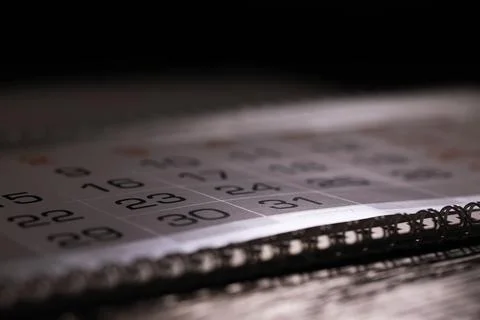 Close-Up of Monthly Calendar with Focus on Dates and Spiral Binding Foto stock