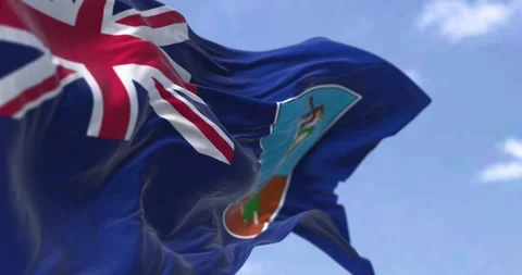 Close-up of Montserrat flag waving in the wind on a clear day Stock Footage 274347487