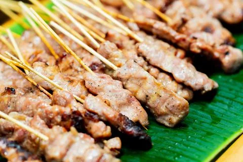 Close up of Moo ping, Slice pork skewer sticks grilled , thai street food mar Stock Photos