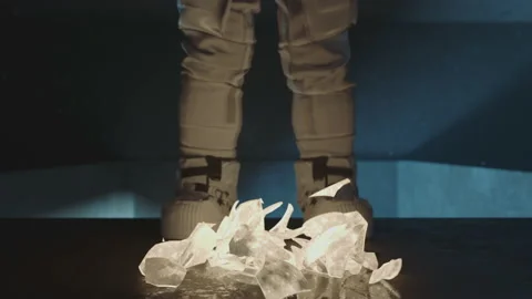 Close up of the moon falling crashing on the ground at the astronaut's feet. Sci Stock Footage 219928730