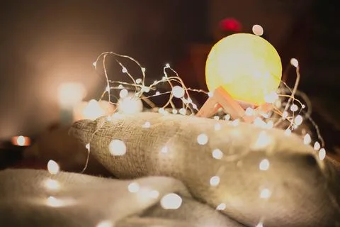 Close up moon lamp with light bulb garland concept photo Stock-Fotos