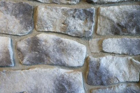 Close-Up of Moon Light Gray Cobblestone Wall Texture with Natural Stone Patte Stock Photos