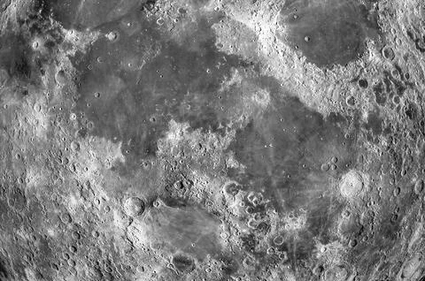 Close-up of moon texture with craters as background Stock Photos