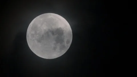 Close up of Moon through fast moving clouds Video stock 89576007