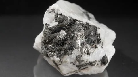 A close-up moonstone. Adular on a black background. Stockbeeldmateriaal 141218119