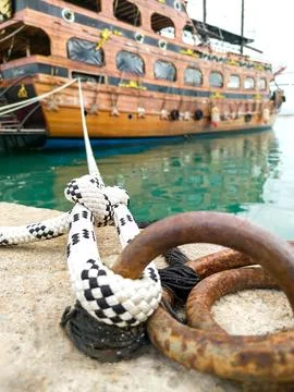 Close-up of mooring cable node of ship, holding moored vessel, symbol of Stock Photos