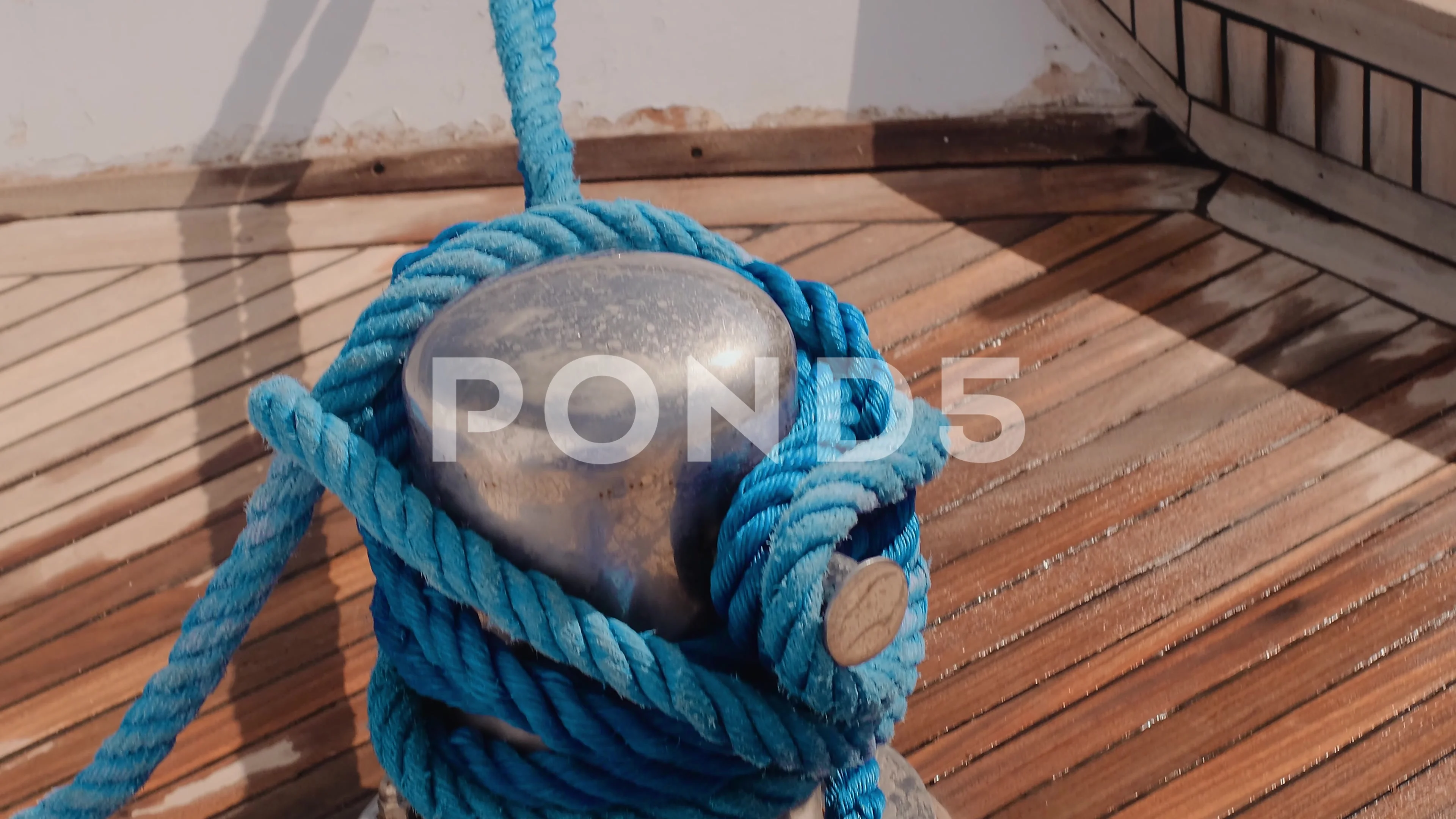 Sailing rope around a bollard - SuperStock