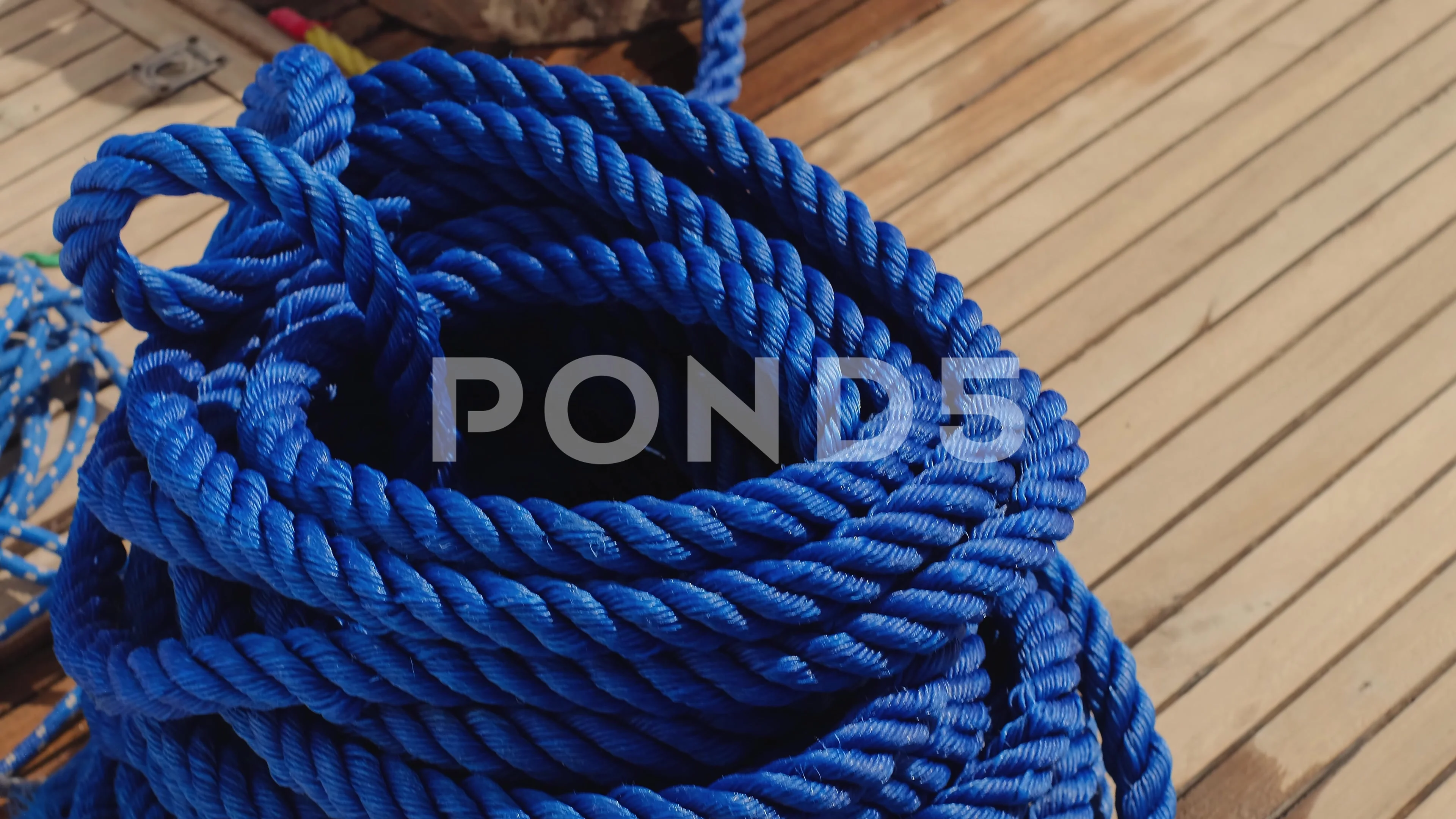 Sailing rope around a bollard - SuperStock
