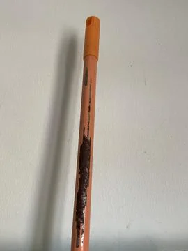 Close-up of Mop Handle with Peeling Orange Paint and Rust Stock Photos
