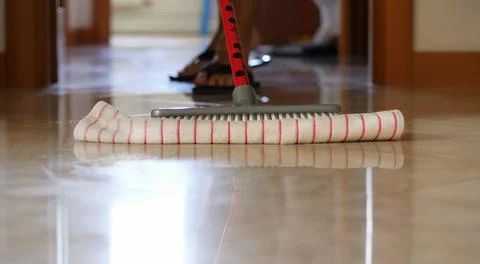 Close-up of the mop with the microfibre cloth when cleaning a polished polish Stock Photos