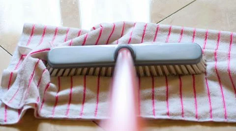 Close-up of the mop with the microfibre cloth when cleaning a polished polish Stock Photos