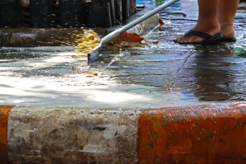 Close up mop worker cleaning dirty footpath Stock Photos