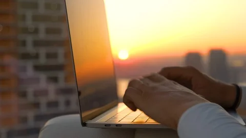 CLOSE UP Morning sun rays shine through the window onto the girl writing a blog 스톡 동영상 109263673