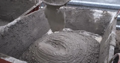 Close-up of a mortar pouring through a spout, a large flow from a concrete mixer Stock Footage 116815552
