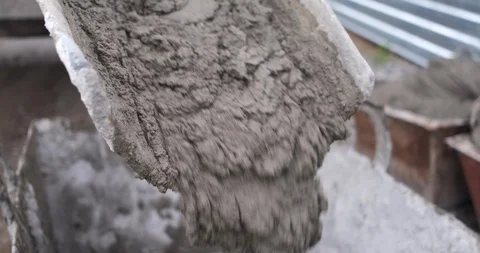 Close-up of a mortar pouring through a spout, a large flow from a concrete mixer Stock Footage 116816140