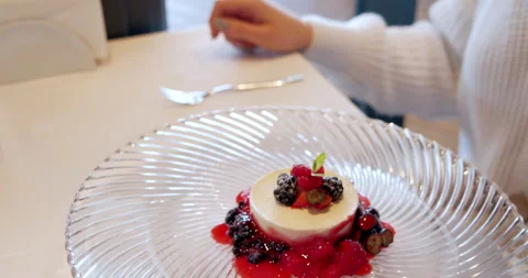 Close-up of the most delicate dessert with pieces of fruit and berries on a Stock Footage 149155406