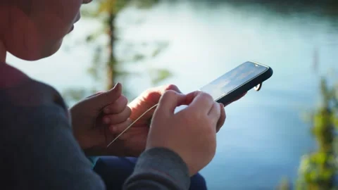 Close up. Mother using her mobile phone apps browsing chatting playing web Stock Footage 152947958