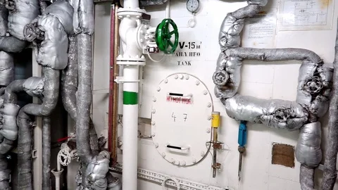 Close motion along pipeline system in tanker engine-room Stock Footage 121119130